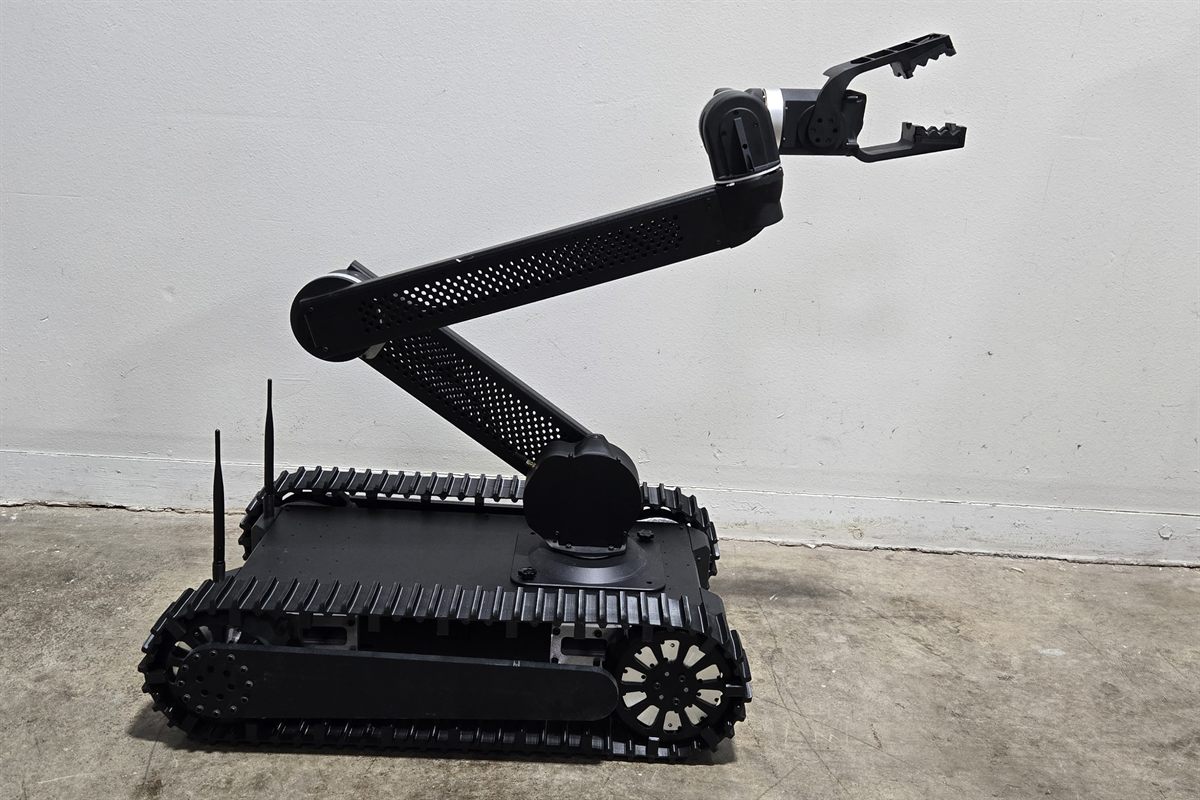 Bulldog tactical robot with the arm raised above the tracked chassis