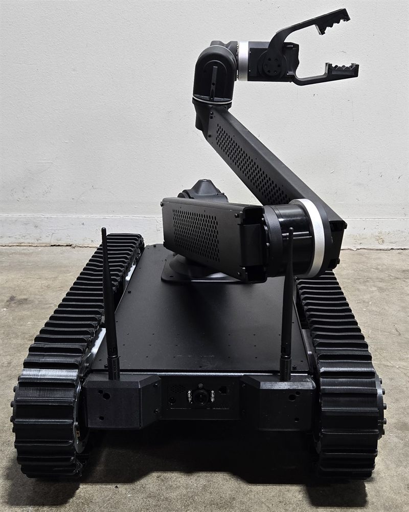 Rear view of the Bulldog robot showing tracks, antennas, and drive camera