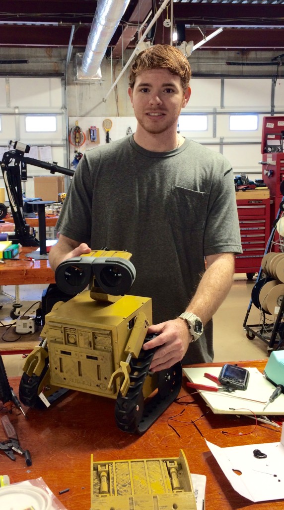 Happy young man playing with his Will-E!