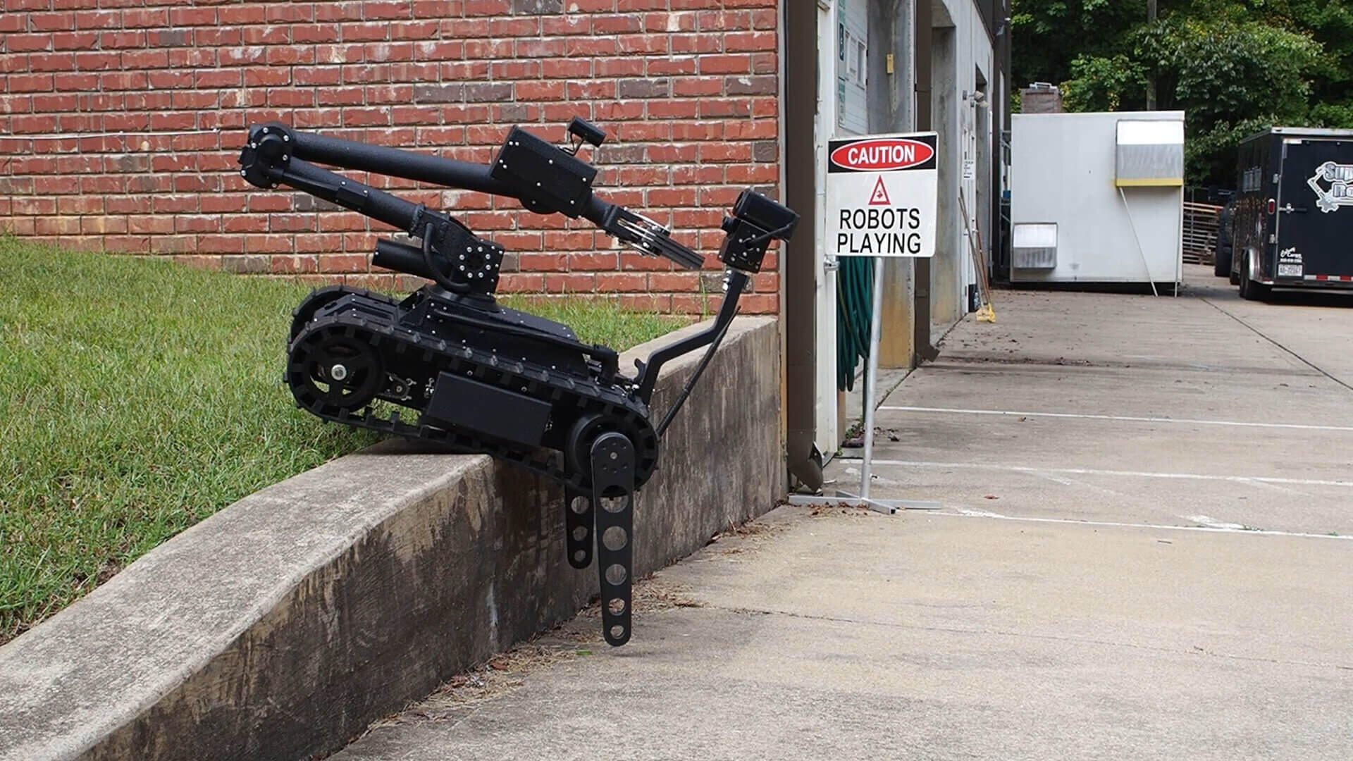Tactical robot scales tall curb